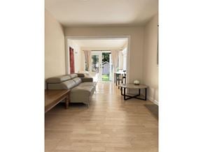 White Rock apartment for rent - A long hallway with a couch and a coffee table.