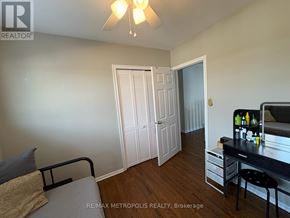 Oshawa (Eastdale) apartment for rent - A bedroom with a bed, desk, and chair.
