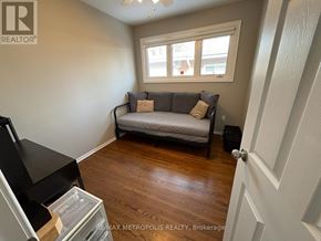 Oshawa (Eastdale) apartment for rent - A bedroom with a bed, a window, and a door.