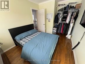 Oshawa (Eastdale) apartment for rent - A bedroom with two beds and a closet full of clothes.