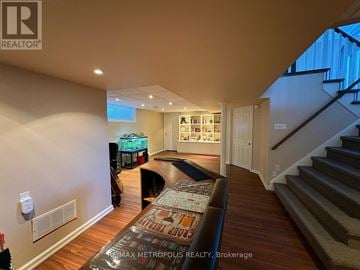 Oshawa (Eastdale) apartment for rent - A living room with a couch and a staircase.
