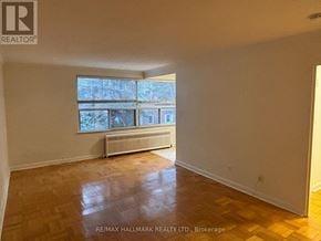 Toronto (Yonge-St. Clair) house for rent - A room with a window and a radiator.