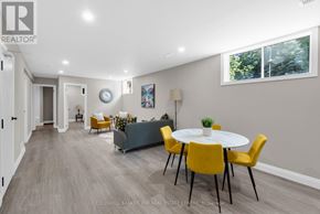 Barrie (Little Lake) apartment for rent - A dining room with a white table and yellow chairs.