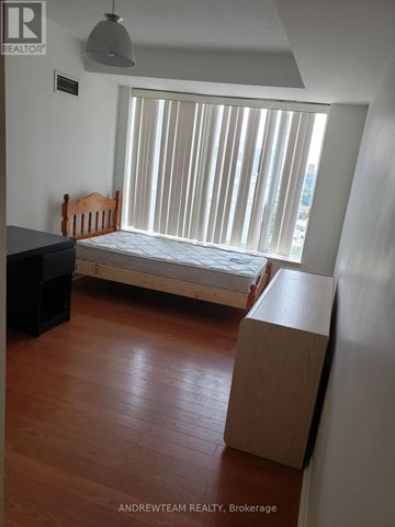 Toronto (Bay Street Corridor) condo for rent - A bedroom with a bed, dresser and window with blinds.
