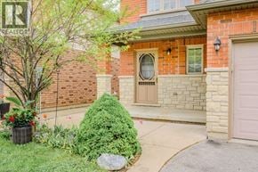 Hamilton apartment for rent - A house with a brown door and a window is shown.