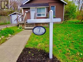 Hamilton (Hamilton Beach) apartment for rent - A wooden deck leads to a white door on a house.