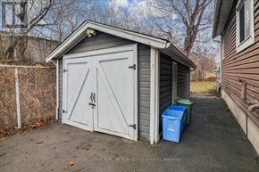 Hamilton (Hamilton Beach) apartment for rent - A small shed with a white door and a blue container in front of it.