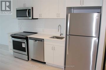 Toronto (Cliffcrest) condo for rent - A kitchen with a stainless steel refrigerator, microwave, oven, and dishwasher.