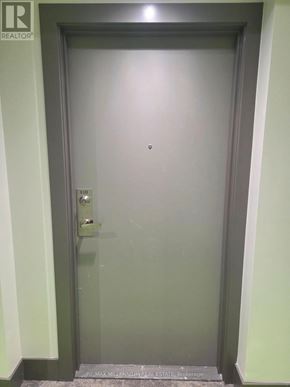 Clarington (Bowmanville) condo for rent - A door with a handle and a keypad on it.