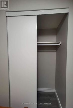 Toronto (Agincourt North) apartment for rent - A white closet with a shelf and a door open.