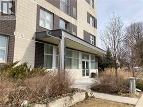 Waterloo condo for rent - A building with the word REALTOR on the side.