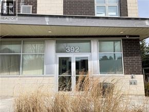 Waterloo condo for rent - The front of a building with the number 392 on it.