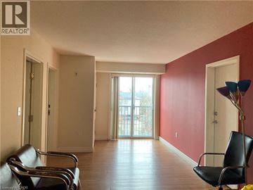 Waterloo condo for rent - A living room with a couch and chairs.