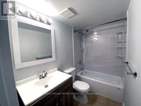 Toronto (Highland Creek) apartment for rent - A bathroom with a white sink, toilet, and bathtub.
