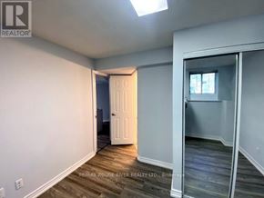 Toronto (Highland Creek) apartment for rent - A room with a door and a window.