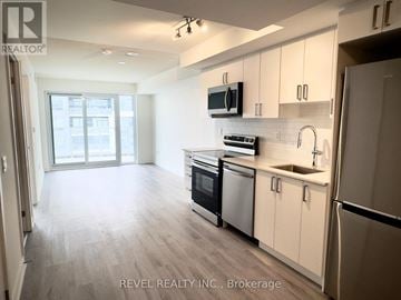 Pickering (Bay Ridges) condo for rent - A kitchen with white cabinets and stainless steel appliances.