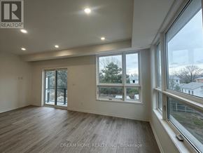Newmarket (Glenway Estates) townhouse for rent - A room with a large window and sliding glass doors.