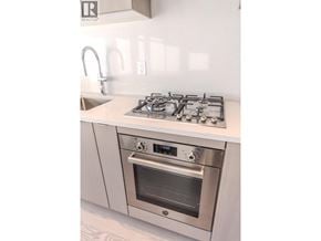 Vancouver apartment for rent - A modern kitchen with a stainless steel gas stove and oven.
