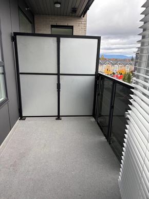 Surrey apartment for rent - A glass door with a black frame is closed.