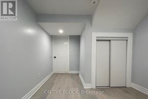 Toronto (Wexford-Maryvale) apartment for rent - A brokerage sign is on the wall in a white room.
