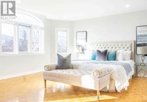 Markham (Milliken Mills East) apartment for rent - A bedroom with a large bed and a window.