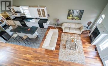 Niagara Falls (Forestview) apartment for rent - A living room with a white couch and a coffee table.