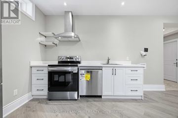 Toronto (Highland Creek) apartment for rent - A kitchen with a stainless steel oven and white cabinets.