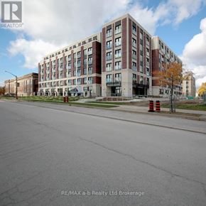 London East (East K) apartment for rent - A large multi-story building with a parking lot in front.
