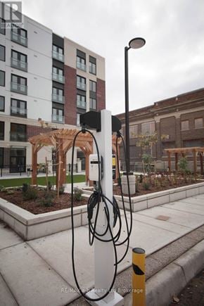 London East (East K) apartment for rent - A charging station for electric vehicles is located on a sidewalk.