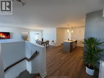 Rockland apartment for rent - A living room with a television and a dining table.
