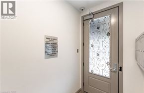 Hamilton apartment for rent - A door with a glass window and a sign on the wall.