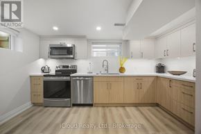Mississauga (Streetsville) condo for rent - A kitchen with wooden cabinets and stainless steel appliances.