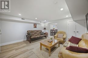 Mississauga (Streetsville) condo for rent - A living room with a sofa, armchair, and coffee table.