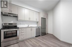 Hamilton (Landsdale) multi-family for rent - A modern kitchen with stainless steel appliances and white cabinets.