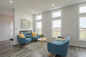 Mitchell apartment for rent - A living room with a blue sofa and a wooden coffee table.