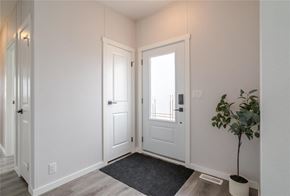 Mitchell apartment for rent - A room with a door, a plant, and a rug.