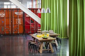 Boston apartment for rent - a dining room with green curtains and a wooden table and chairs