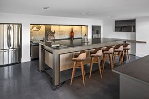 Boston apartment for rent - a kitchen with a long counter and bar chairs
