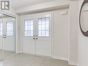 Brampton (Northwest Brampton) apartment for rent - A white double door with a glass window is closed.