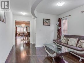 Brampton (Northwest Brampton) apartment for rent - A living room with a couch, coffee table, and a painting on the wall.