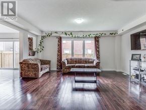 Brampton (Northwest Brampton) apartment for rent - A living room with a couch, chair, and a coffee table.