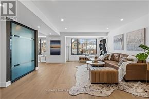 Ottawa apartment for rent - A modern living room with a glass door and a brown sofa.