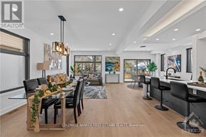 Ottawa apartment for rent - A modern dining room with a wooden table and chairs.