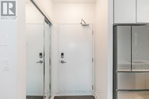 Innisfil condo for rent - A white door with a glass panel is in a hallway.