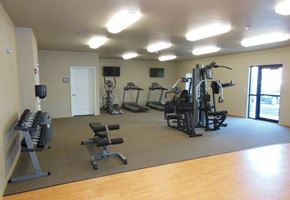 Moorhead apartment for rent - a gym with a lot of exercise equipment in it