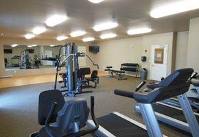 Moorhead apartment for rent - a gym with a lot of exercise equipment in it