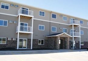 Moorhead apartment for rent - an apartment building with balconies and a front door
