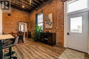 Chatham apartment for rent - A room with a brick wall and a wooden floor.