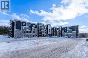 Guelph condo for rent - A large apartment complex with a REALTOR® logo in the corner.