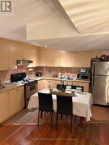 Mississauga (Meadowvale Village) apartment for rent - A kitchen with a table set for two with a bottle of wine on it.